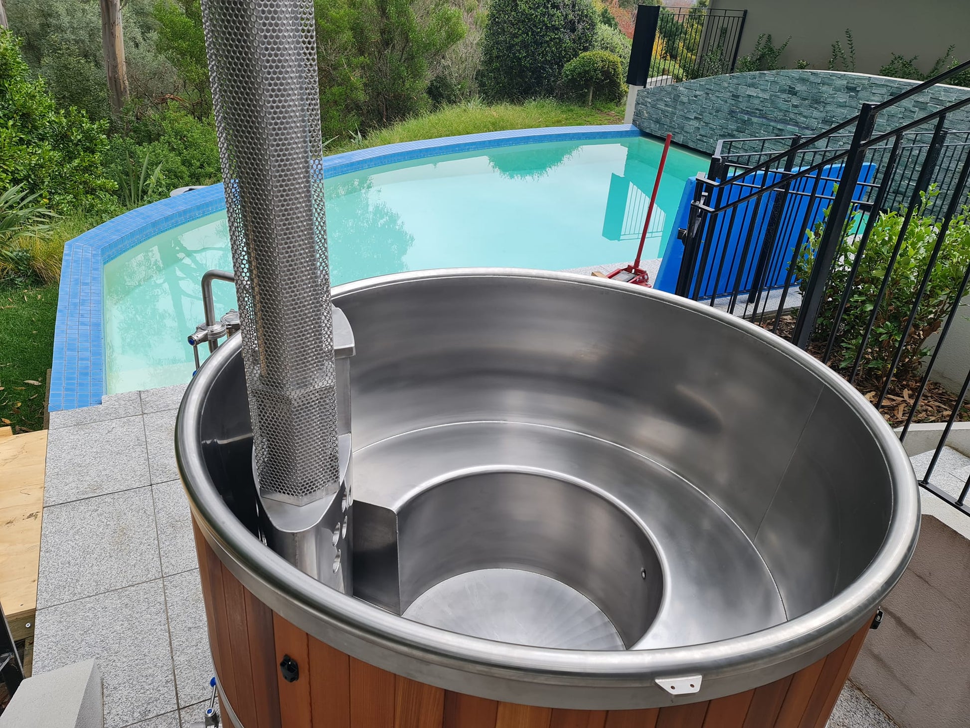 Wood-fired burner and electric heating system, outdoor spa