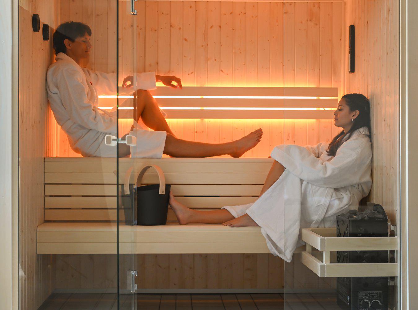 Hanko 60 STJ sauna heater with integrated water tank and sauna stones for gentle steam