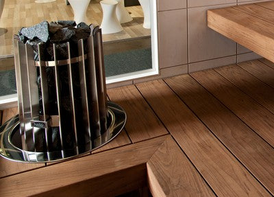 The Helo Rocher 105 Elite Sauna Heater features a sculptural round design with 100 kg stone capacity for soft, drop-like steam. Includes Elite controller. 